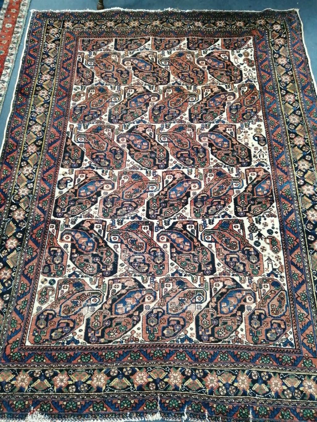 A Chinese style beige ground carpet, a Tabriz style green ground rug and a North West Persian style rug, largest 270 x 190cm